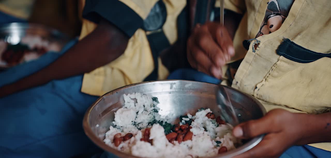 A meal with rice, beans and spirulina, shown in Properly’s Madagascar project footage